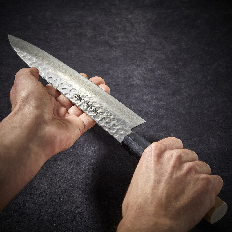 Chef knife with 45-layer hammered Damascus blade 210 mm